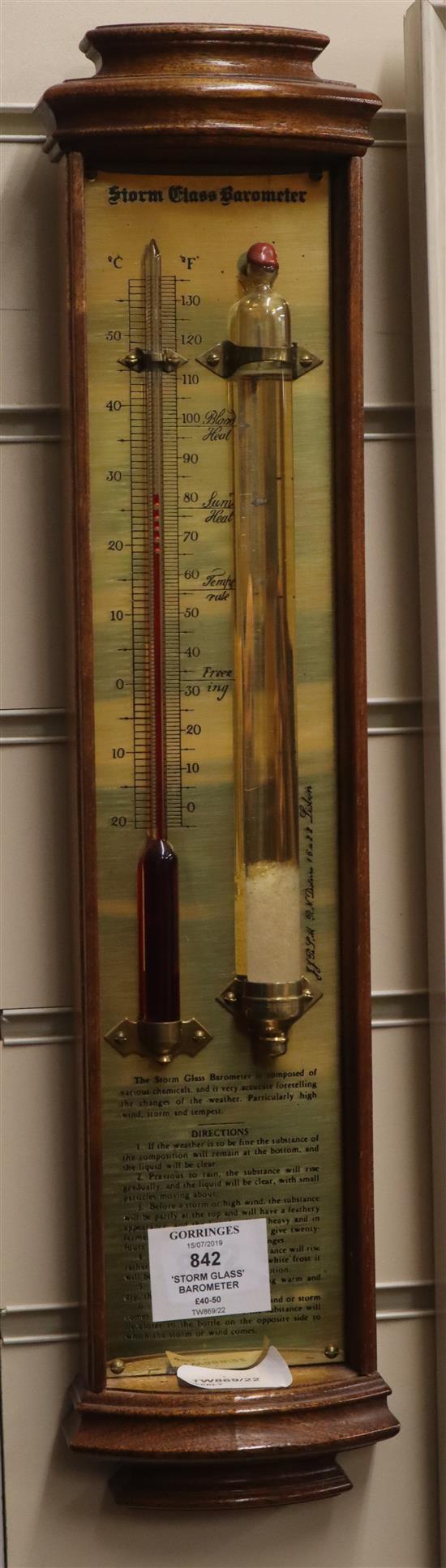 A modern storm glass barometer in bow-fronted case H.46cm